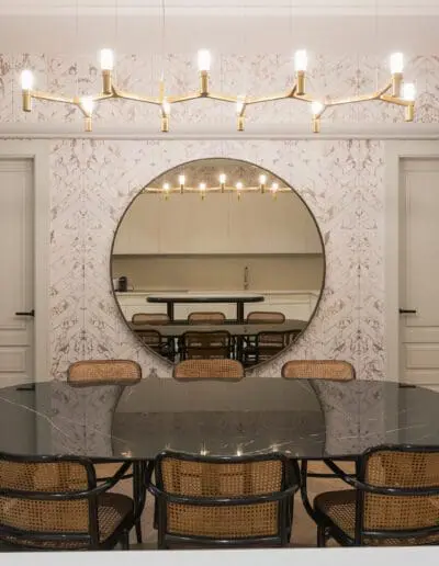 Dinimng Table with black ceramic top - Vintage Thonet Vienna Chairs - Crown Lamp by Nemo - Wallpaper by NXLX