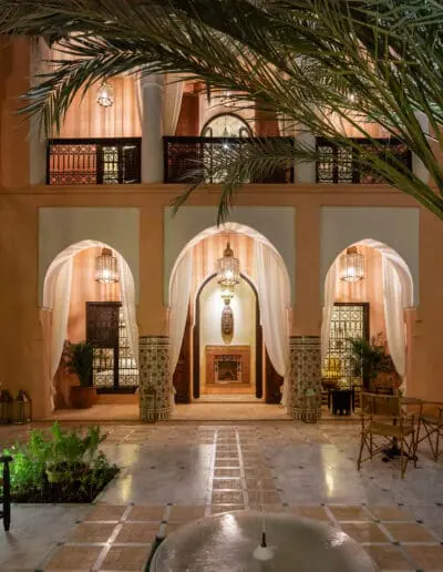 Recdi8 Living Interior Design - Marrakech Riad Restoration - Patio at Night with the MMUDDU Suite in the Background
